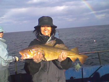 Femal angler with cod